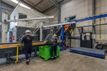 Loading EV batteries onto shredder feed battery recycling